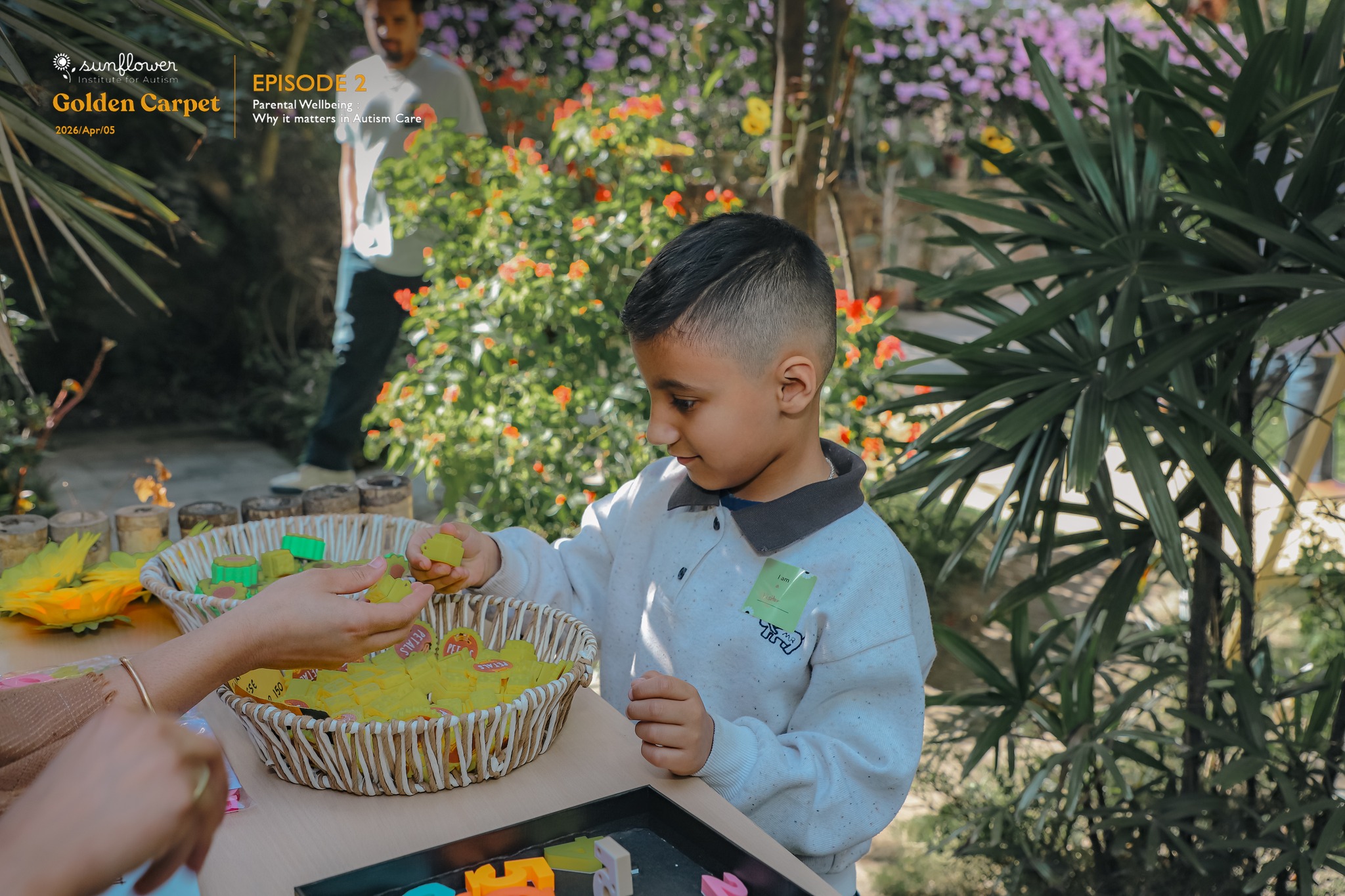 Child engaging in a playful learning activity during a Sunflower community autism support session